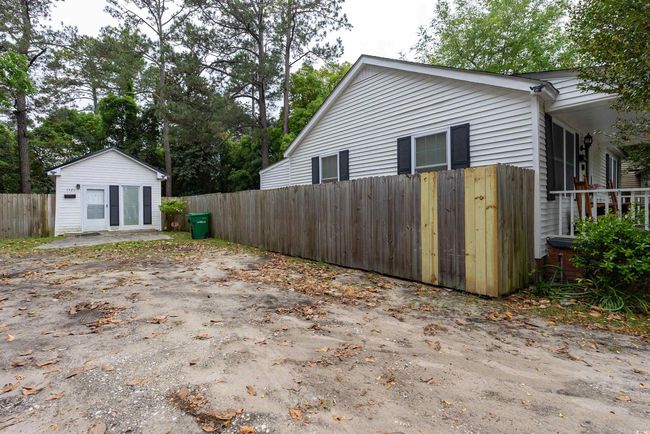View of side of home featuring fence | Image 16