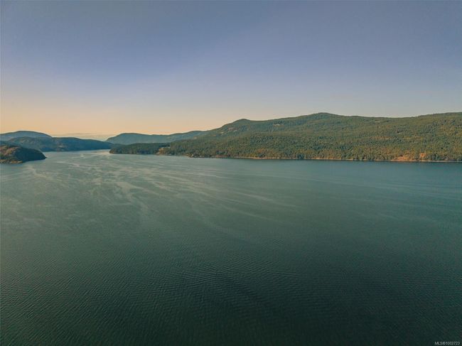 Water view with a mountainous background | Image 97