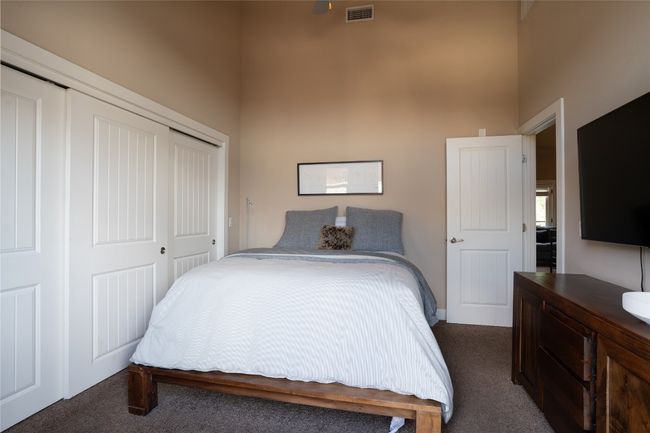 Second Bedroom a closet, and a towering ceiling | Image 20