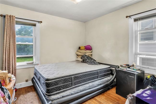 Bedroom with multiple windows and hardwood / wood-style floors | Image 12