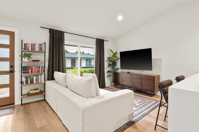 Living room featuring lofted ceiling, light wood-style floors, and recessed lighting | Image 4