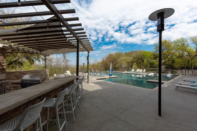 Community pool featuring a pergola and a patio area | Image 6