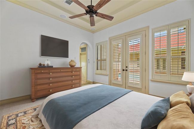 Guest Quarters w/Bar area, walk in closet, plantation shutters, ceiling fan, tray ceiling & ensuite bathroom which leads out to your beautiful pool. Virtually staged for your designing ideas | Image 35