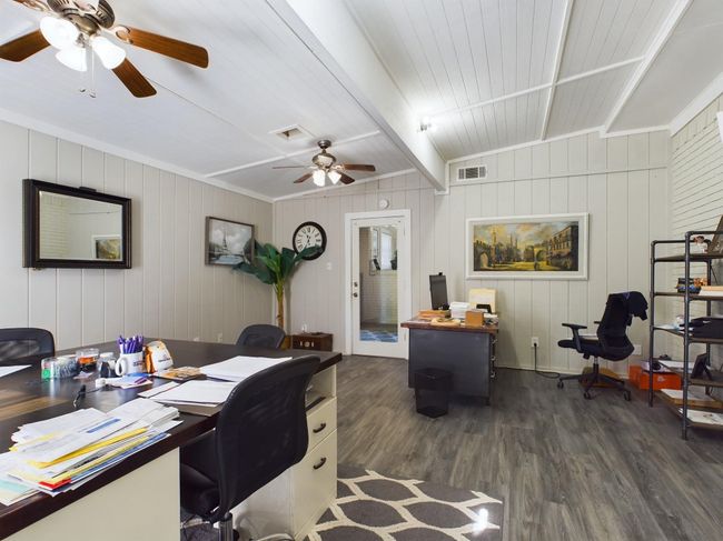 Office with dark wood-style flooring, beamed ceiling, and ceiling fan | Image 18