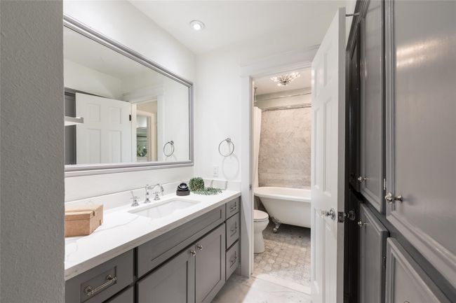 Jack and Jill bathroom with updated marble flooring | Image 32