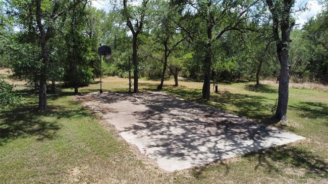 Basketball Court / RV hook up. Electric on the pole to the right of the basketball hoop. | Image 31