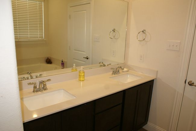 Full bath with double vanity, a bath, and a sink | Image 24