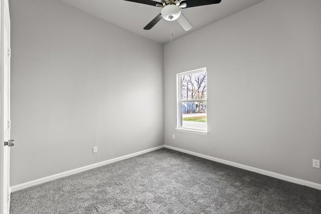 Carpeted bedroom featuring ceiling fan | Image 22