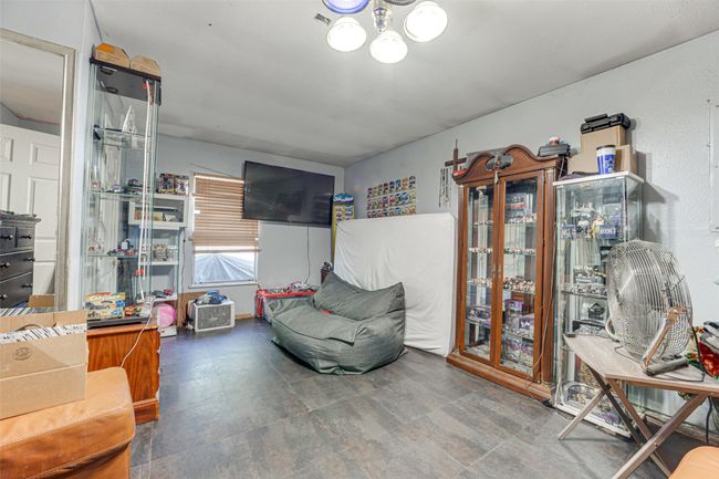 Living area featuring a notable chandelier | Image 13