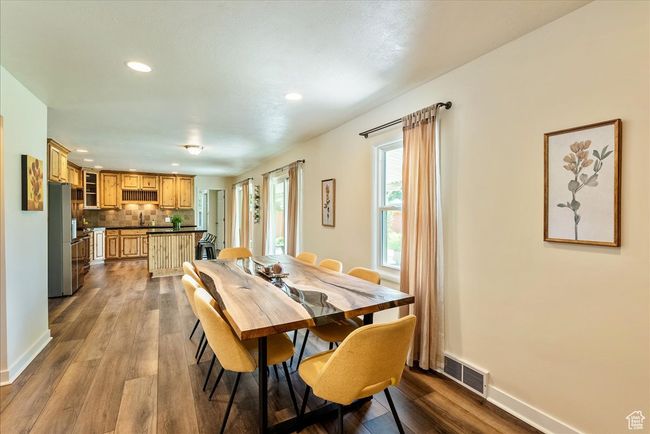 Dining space with recessed lighting and dark wood finished floors | Image 25