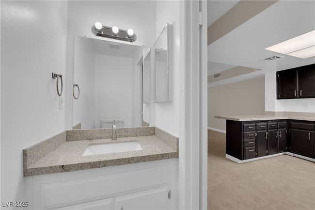 Bathroom with vanity, toilet, and tile patterned floors | Image 9