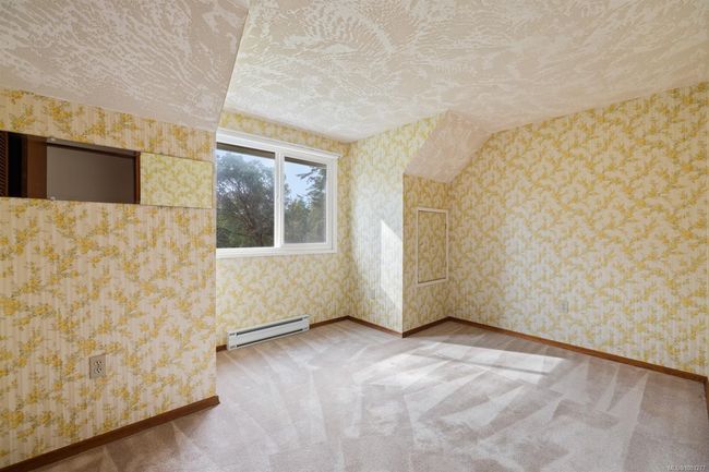 Bonus room with baseboard heating, carpet floors, baseboards, and wallpapered walls | Image 27