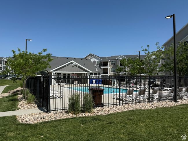 Community pool featuring a residential view and a patio area | Image 30