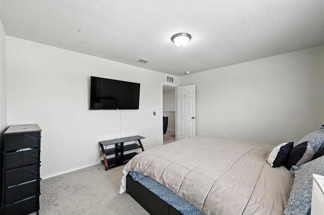 Bedroom featuring carpet floors and baseboards | Image 33
