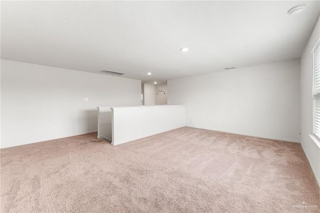 Unfurnished room with light carpet and recessed lighting | Image 16