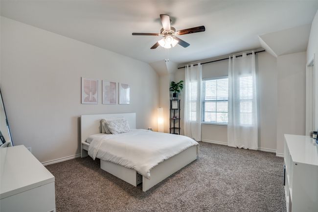 Carpeted bedroom featuring baseboards and ceiling fan | Image 18