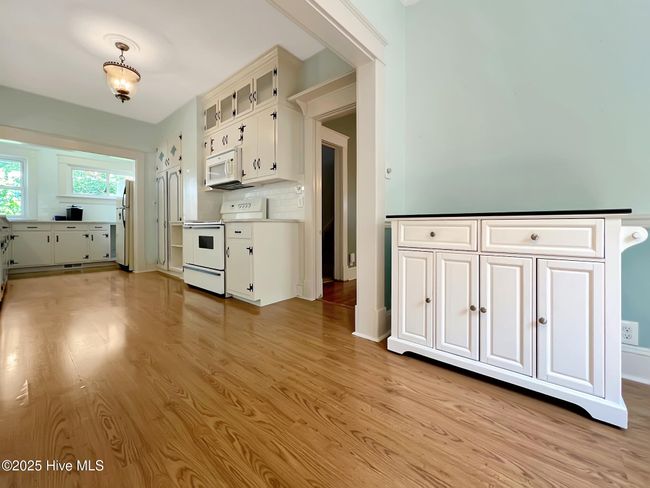 Spacious kitchen view of the eating area | Image 10