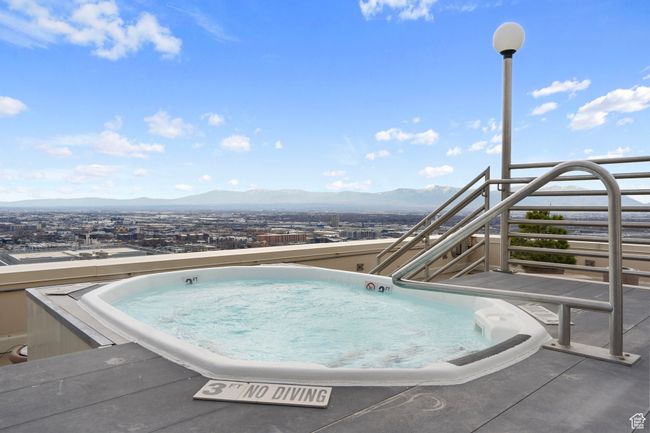 View of pool featuring a mountain view and a hot tub | Image 41