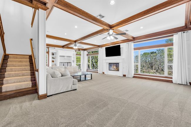 Massive family room with wood burning fireplace overlooks the pond. | Image 17