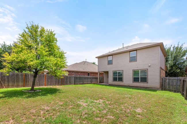 Rear view of house with a fenced backyard | Image 31