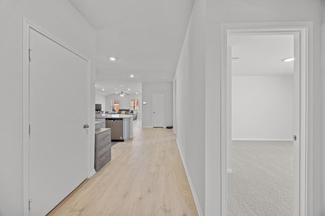 Hallway featuring recessed lighting, light wood-look flooring, and baseboards | Image 6