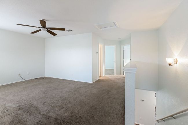 Carpeted Gameroom featuring baseboards, attic access, and a ceiling fan | Image 22