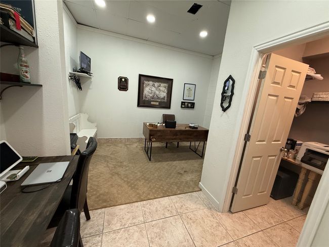 Office area featuring light colored carpet and light tile patterned floors | Image 11