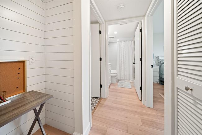 Hallway leading into guest bedroom and bathroom | Image 15