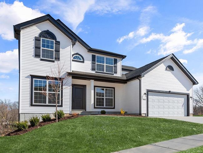 View of front property with a garage and a front lawn | Image 29