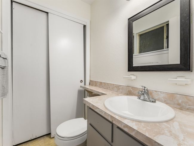 Bathroom featuring vanity and toilet | Image 22