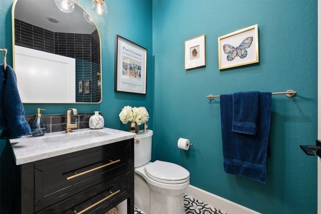 This stunning bathroom includes a gorgeous tiled shower. Conveniently located across from second office area, living spaces and secondary bedrooms. | Image 18