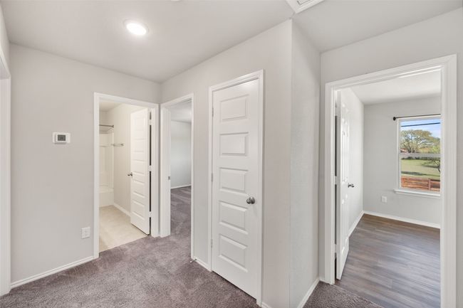 Hall featuring baseboards and carpet floors | Image 7