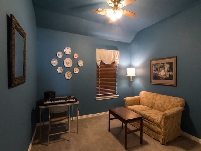 Secondary bedroom currently being used as a sitting area. | Image 29