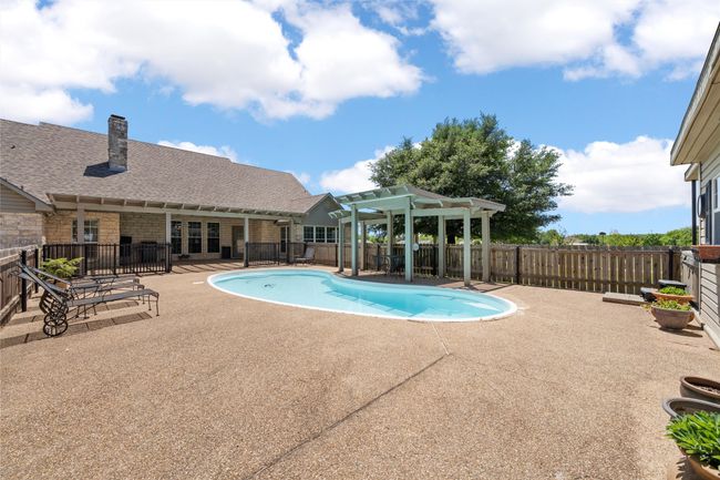 View of pool with a pergola, fence, a patio area, and a fenced in pool | Image 28