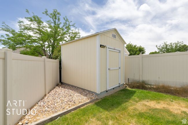 View of shed with a fenced backyard | Image 26