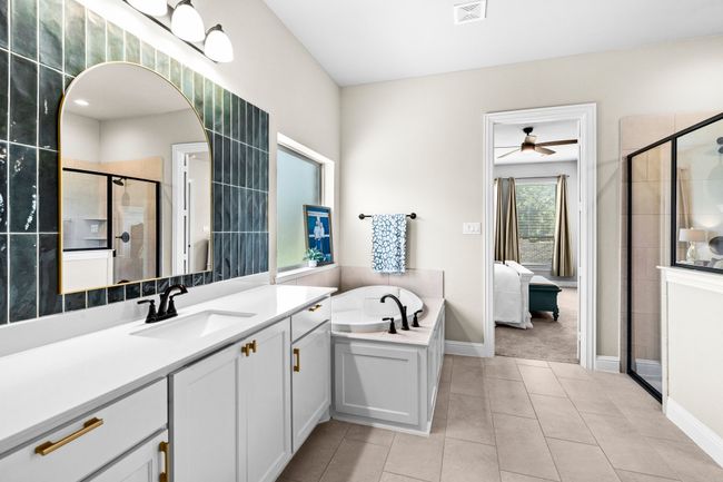 Ensuite bathroom with a bath, vanity, a stall shower, tile patterned flooring, and ceiling fan | Image 23