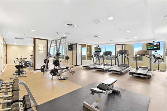 Experience a spacious fitness center with top-notch equipment and a relaxing dry sauna. | Image 23