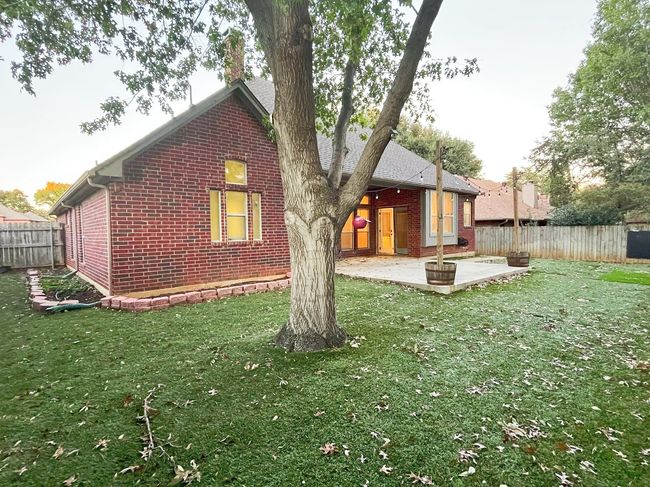 Back of house with a yard and a patio area | Image 34