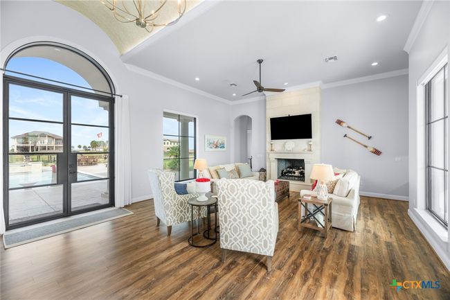 Living Room with Gas Fireplace, Wet Bar, and Double Exterior Doors | Image 4