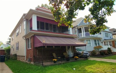 Covered upper and lower porches. | Image 1