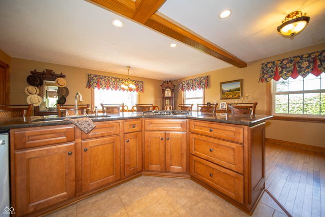 Kitchen with beautiful Maple cabinets, Stainless Steel Appliances, Recessed lights & Ceramic tile floor. | Image 11
