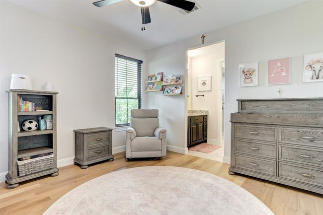 Bedroom with wood floors and attached bathroom | Image 23