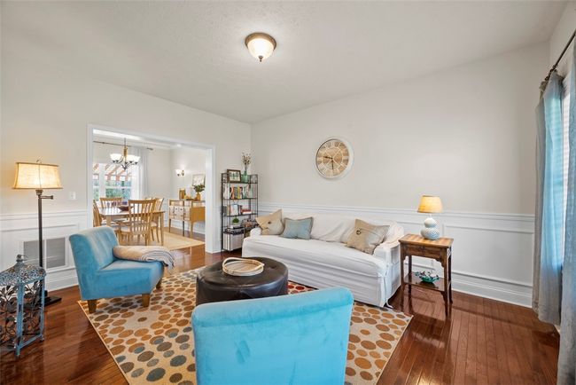Whether you are looking for a formal living room or an area for the kids to play, this versatile space has you covered. | Image 19