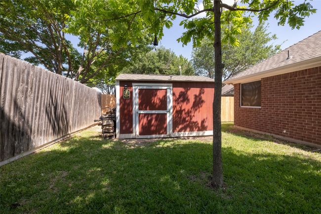 View of shed with a fenced backyard | Image 33