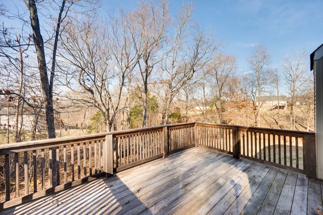 Brew a cup of coffee and enjoy the private deck off of the first floor kitchen. | Image 42