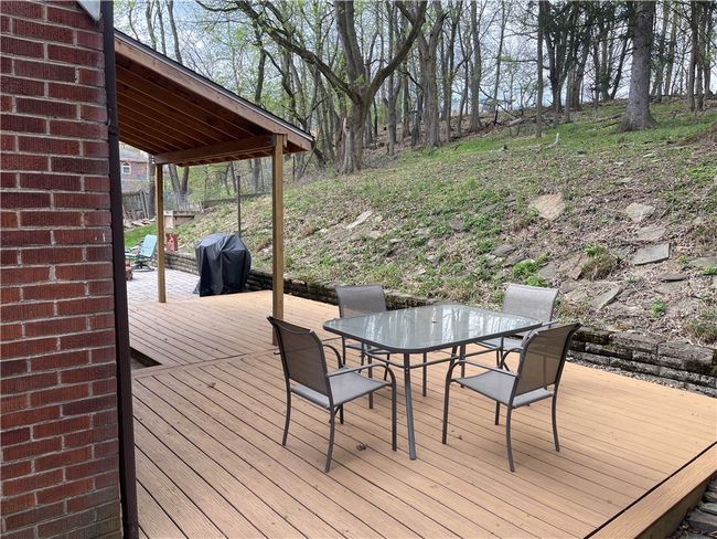 back patio w/ wooded view | Image 5