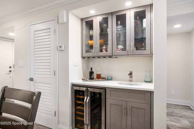 Wet bar in the dining area with wine frig | Image 17
