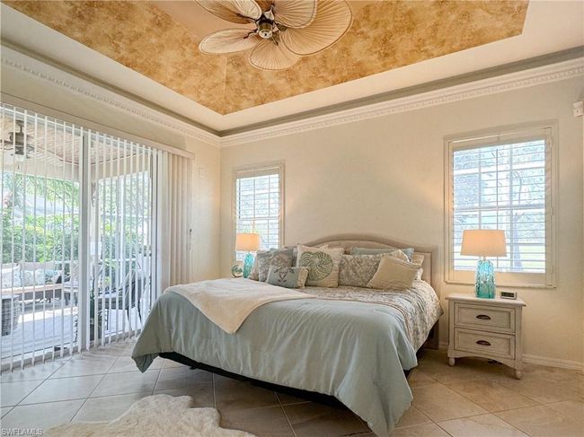 Bedroom with ceiling fan, access to exterior, and multiple windows | Image 44