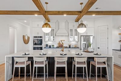 Just look at this beautiful kitchen in the popular Wentworth plan! These are pictures of a similar Wentworth we built. Selections in Lo t201 will be different. See agent for selections. | Image 1