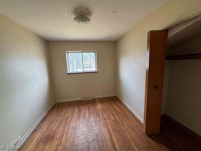 Empty room with dark hardwood / wood-style floors | Image 10